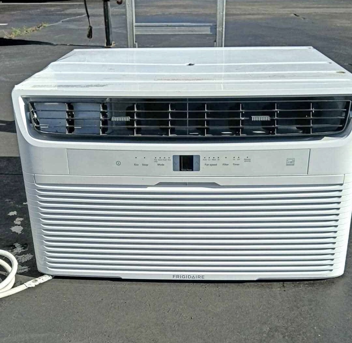 White Frigidaire window air conditioning unit, front view showing the vent, control panel and display