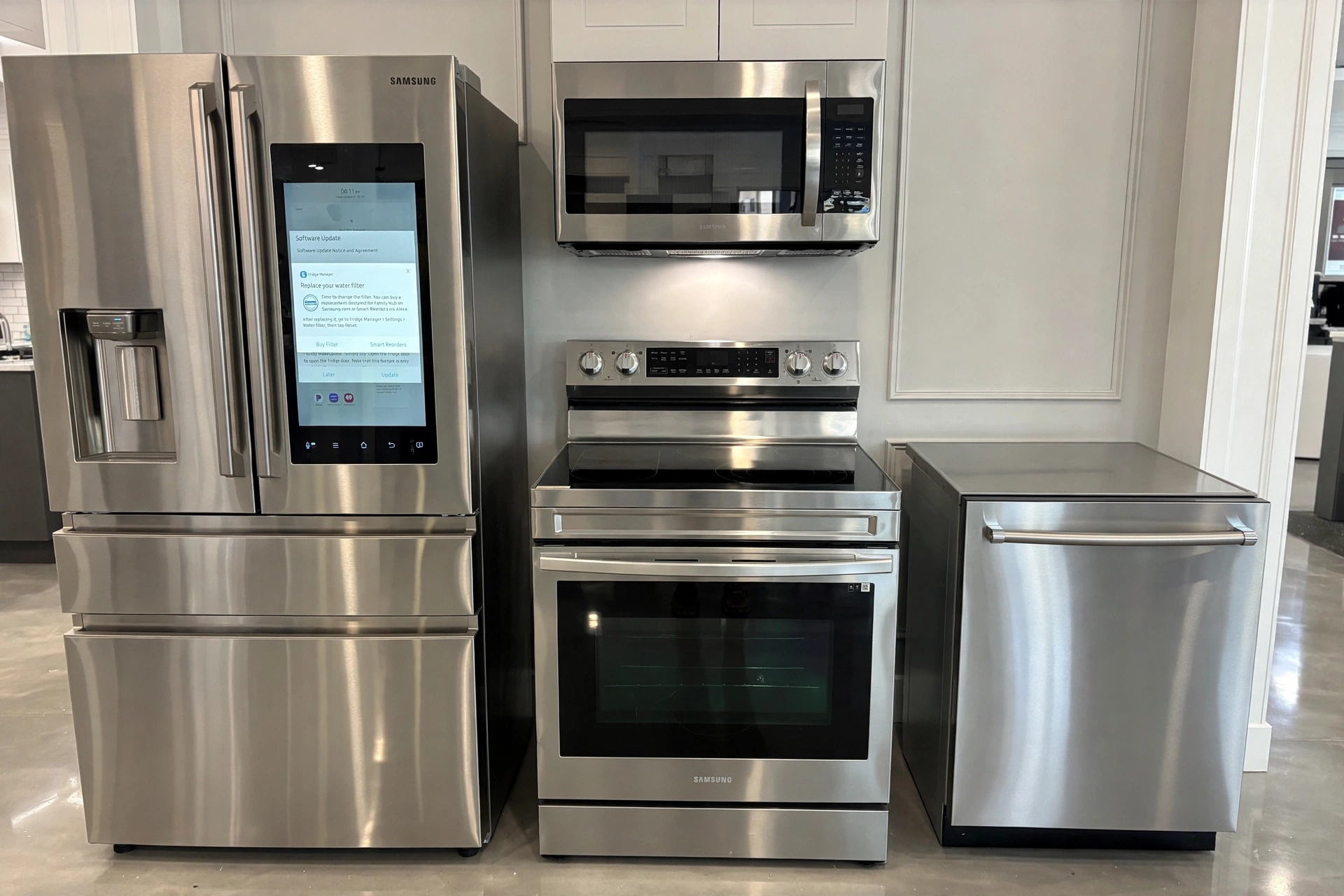 Samsung stainless kitchen suite at Five Star Appliance Group — Family Hub refrigerator, electric range, over-the-range microwave and dishwasher
