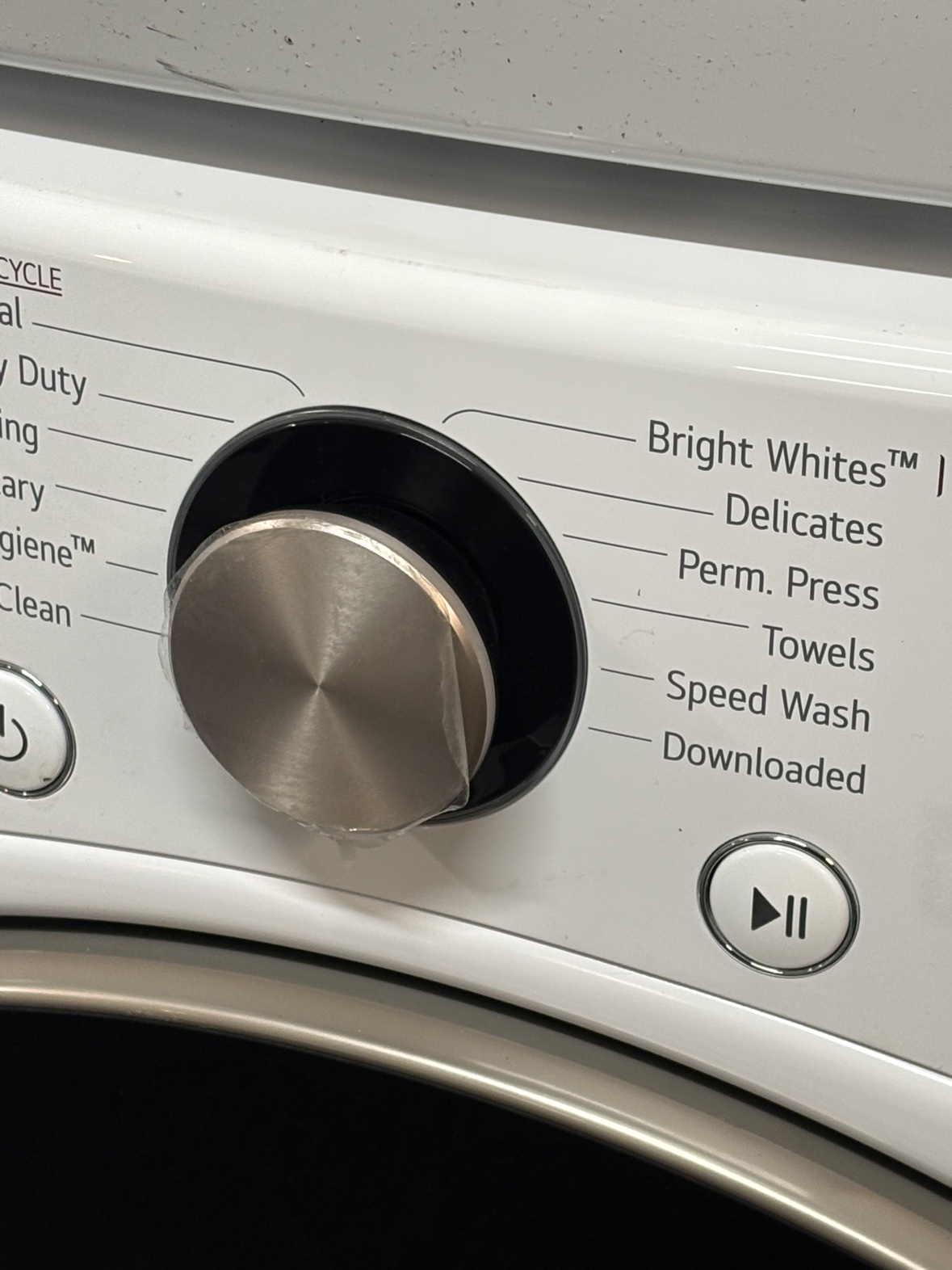LG ThinQ washer control panel with brushed steel cycle selector dial