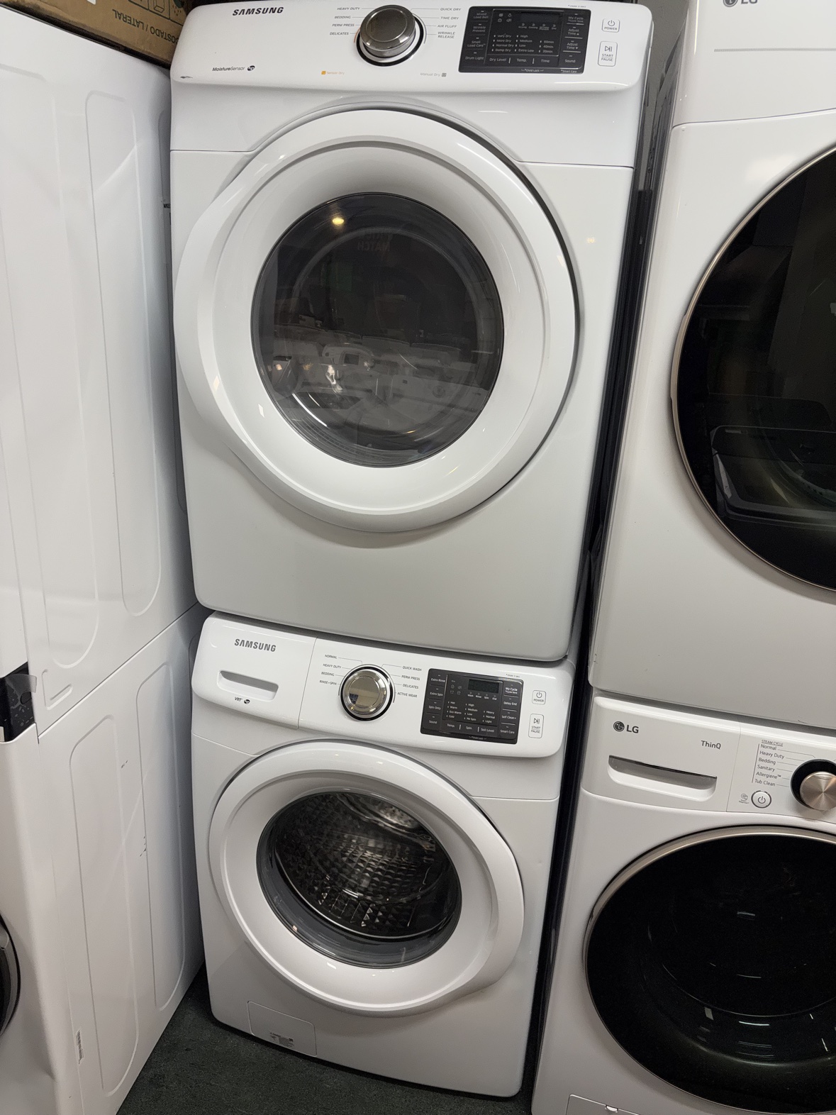 Samsung white front-load washer and dryer set from a second angle