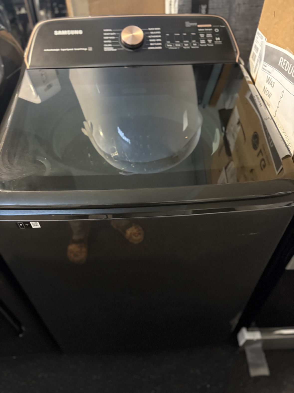Samsung black stainless top-load washer, front view