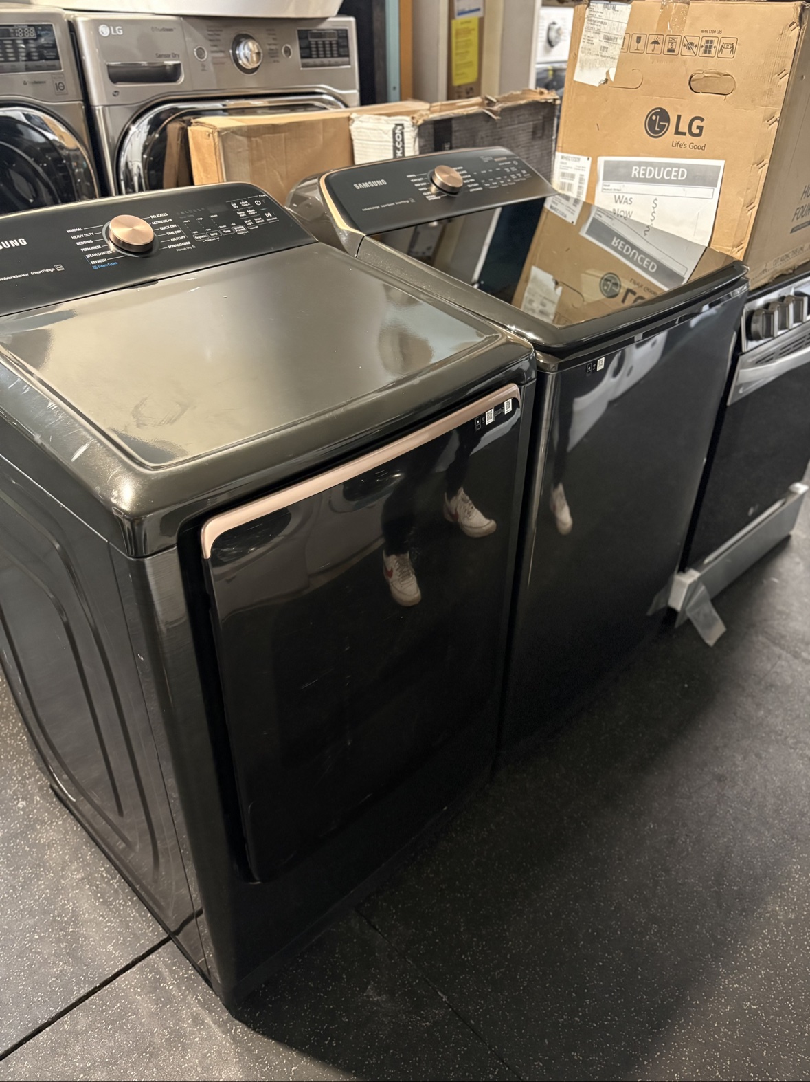 Samsung black stainless washer and dryer set from a second angle