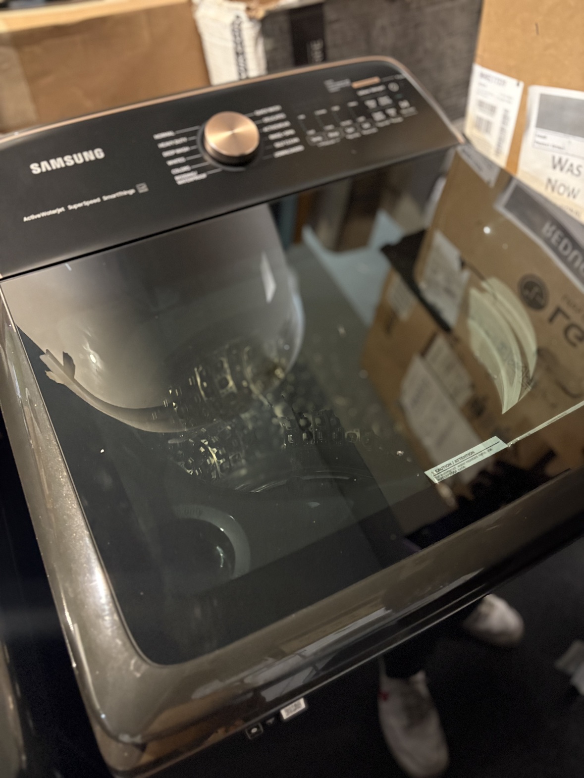 Samsung black stainless top-load washer with glass lid